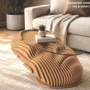 May include: A light brown wooden coffee table with a layered, wavy, parametric design and an oval glass top. The table features the text "PARAMETRIC COFFEE TABLE CNC & LASER CUT FILES" in the upper right corner, with a small potted plant and books.