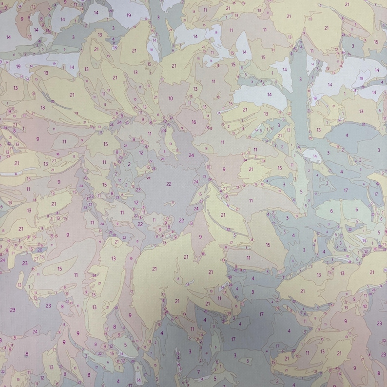 May include: A paint-by-number canvas featuring a floral composition with numerous segmented shapes outlined in black. Each section contains a printed number indicating a specific color to be applied, with shades of beige, gray, and muted blue.