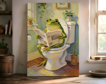 May include: A whimsical canvas print depicts a green frog sitting on a toilet, engrossed in reading a newspaper. The artwork features a bright, sunny bathroom scene with a white toilet, plants, and a window, creating a humorous and lighthearted atmosphere.