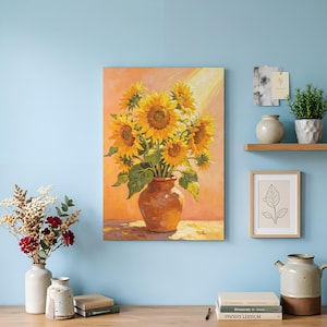 May include: A rectangular canvas painting featuring a bouquet of vibrant yellow sunflowers in a brown ceramic vase against a warm orange background. The artwork displays visible brushstrokes and a light-filled composition with green leaves.