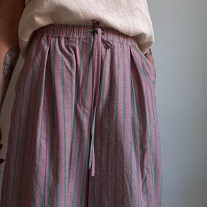 May include: A set of three ceramic mugs with a speckled, matte finish. The mugs are in shades of cream, light gray, and dark gray. Each mug has a simple, minimalist design, perfect for coffee or tea.