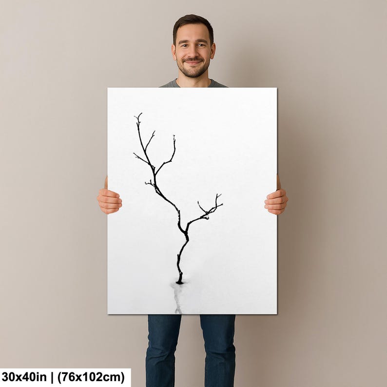 May include: A black and white art print featuring a minimalist tree silhouette against a white background. The artwork measures 30x40 inches.