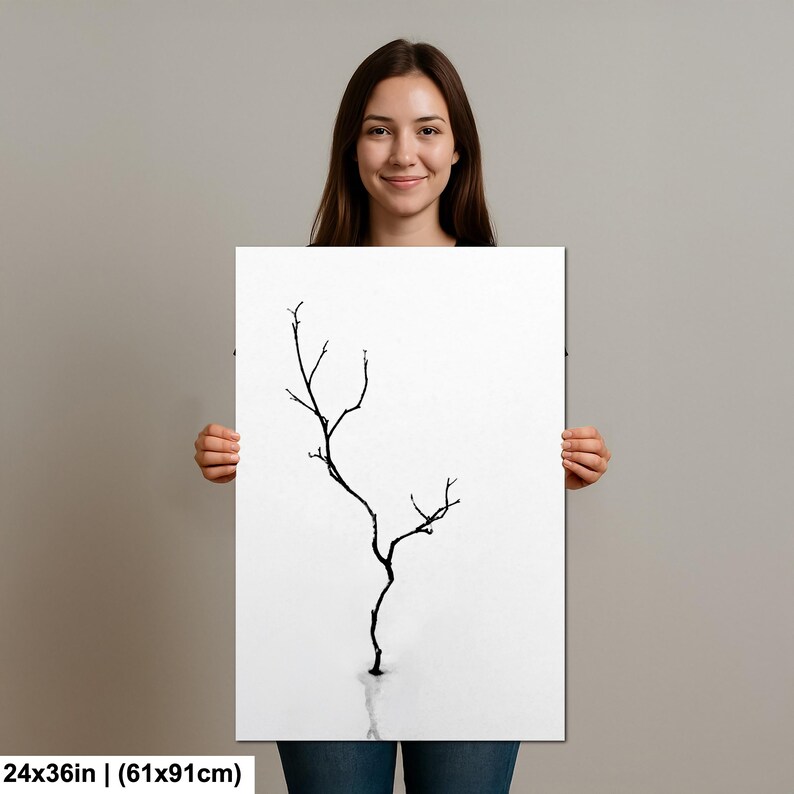 May include: A black and white art print featuring a minimalist illustration of a bare tree branch. The artwork is displayed on a white background and measures 24x36 inches.