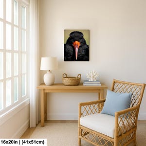 May include: A close-up photograph of a black bird with a long, orange beak. The bird's feathers are dark and textured, and the background is a soft, muted green. The image is a 16x20 inch (41x51cm) print.