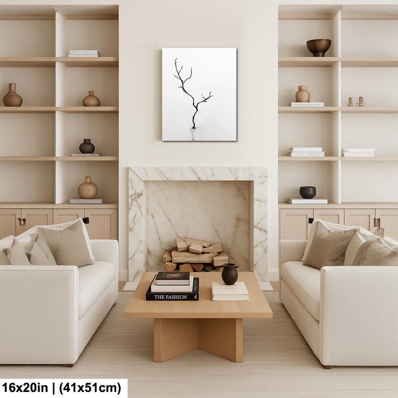 May include: A black and white canvas print featuring a minimalist tree branch design. The artwork is displayed in a modern living room setting, with a size of 16x20 inches (41x51cm). The print is mounted above a fireplace.