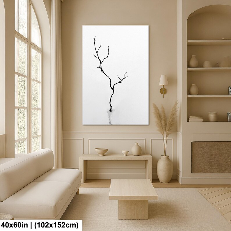 May include: A black and white canvas print featuring a minimalist depiction of a bare tree branch. The artwork is set against a white background, creating a stark contrast. The print measures 40x60 inches.