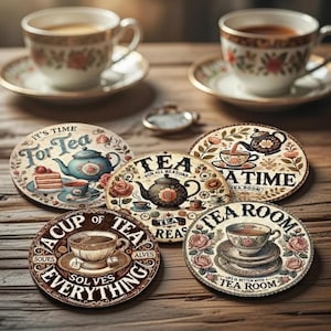 May include: A set of decorative tea coasters with vintage-style designs. The coasters feature text such as "Tea for All Reasons" and "Tea Room." The image also shows two teacups and saucers, with floral patterns, on a wooden surface.