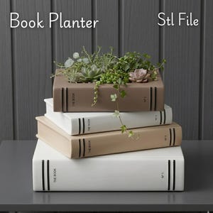 May include: A set of three ceramic mugs with a speckled, matte finish. The mugs are in cream, light grey, and dark grey. Each mug has a simple, minimalist design, ideal for coffee or tea.