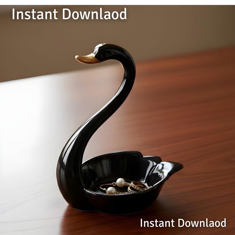 May include: A black ceramic swan-shaped jewelry dish with a gold beak. The dish holds a few rings and a pair of pearl earrings. The words "Instant Download" are at the top and bottom of the image.