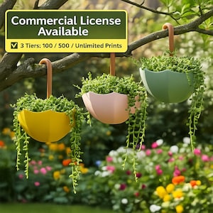 May include: Three hanging planters in yellow, pink, and green, each filled with green plants and trailing vines. The planters are suspended from a tree branch with brown hooks. The image includes text that says "Commercial License Available" and "3 Tiers: 100 / 500 / Unlimited Prints."