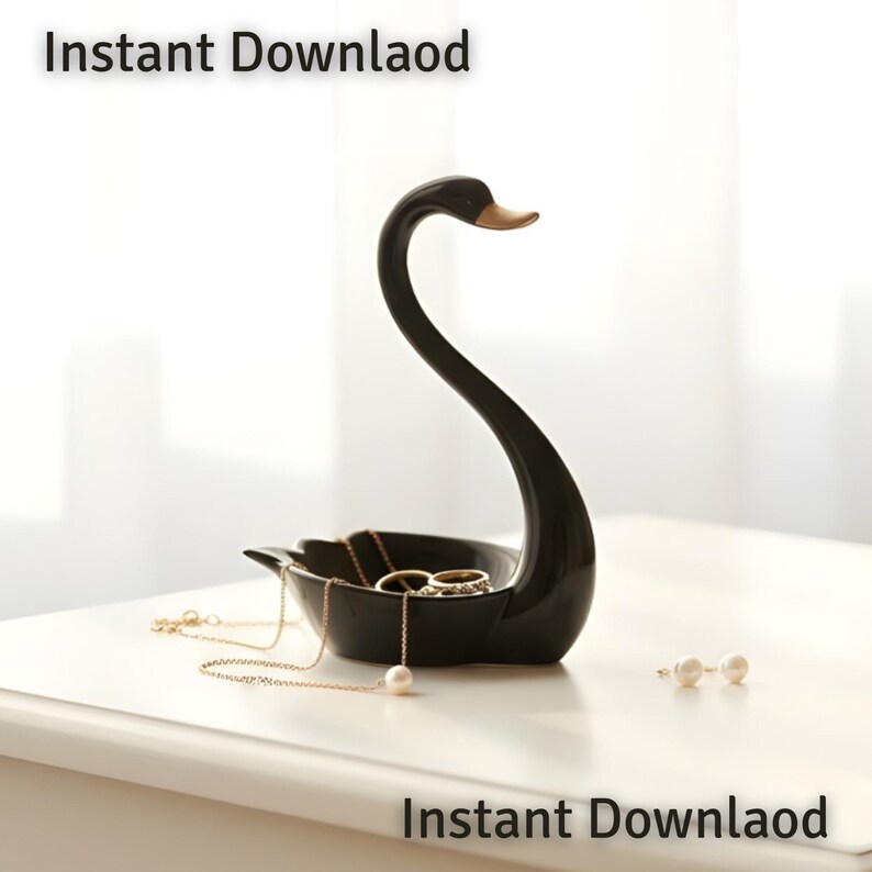 May include: A black swan-shaped jewelry dish with a gold-colored beak. The dish holds gold necklaces, rings, and pearl earrings. The words "Instant Download" are printed at the top and bottom of the image.