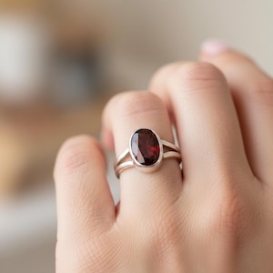 May include: A set of three ceramic mugs with a speckled, matte finish. The mugs are in shades of cream, light gray, and dark gray. Each mug has a simple, minimalist design, perfect for coffee or tea.