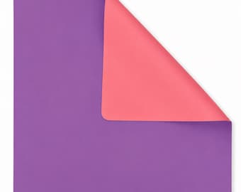 May include: A rectangular mat with rounded corners featuring a dual-sided design. One side is a solid deep purple color, while the top right corner is folded over to reveal a solid coral pink underside, creating a clear contrast between the two colors.