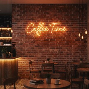 May include: A warm, inviting coffee shop interior with a brick wall and a neon sign that reads "Coffee Time." The scene includes wooden tables, chairs, and a counter, creating a cozy atmosphere. Overhead, decorative lights add to the ambiance.