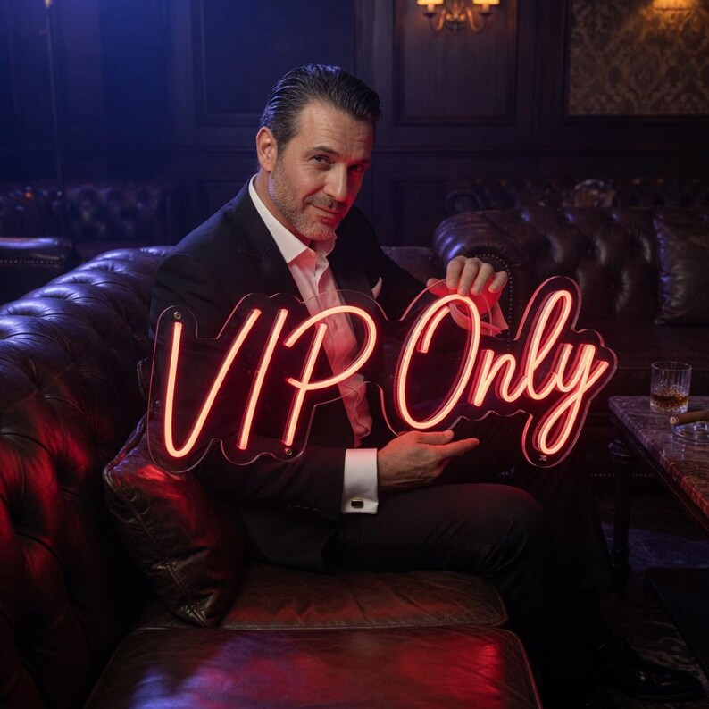 May include: A custom neon sign featuring the text VIP Only in a bright red script font. The sign is constructed with a clear acrylic backing that follows the contour of the glowing red lettering, creating a vibrant and illuminated display.