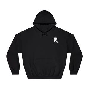 May include: Black hooded sweatshirt with a kangaroo pocket and a white graphic on the upper left chest. The graphic is a stylized bunny head with a bow tie. The hoodie has a drawstring hood.
