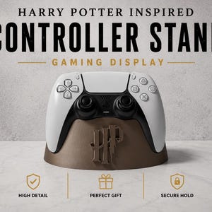 May include: A white and black gaming controller rests on a brown stand with the text "HARRY POTTER INSPIRED CONTROLLER STAND GAMING DISPLAY". The stand features the Harry Potter logo.