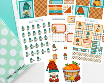 May include: A set of printable planner stickers featuring gnomes, pumpkins, and fall-themed designs. The stickers include a calendar, to-do list, and various decorative elements. The stickers are in a teal, orange, and brown color scheme.