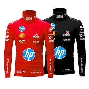 May include: Two long-sleeved mock neck shirts, one red and one black, featuring sponsor logos and the text "LEWIS HAMILTON". The red shirt has the number "44" and a British flag. Both shirts have "RICHARD MILLE" printed on the sleeves.