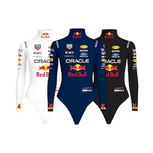 May include: Three long-sleeved bodysuits in white, navy blue, and black. Each features the Red Bull logo, sponsor logos, and the text "ORACLE" and "MAX". The bodysuits have a high neckline and are form-fitting.