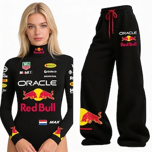 May include: Black Red Bull bodysuit and matching black sweatpants. The bodysuit has long sleeves and a mock neck, featuring logos and text including "ORACLE" and "Red Bull". The sweatpants have a red drawstring and the Red Bull logo.