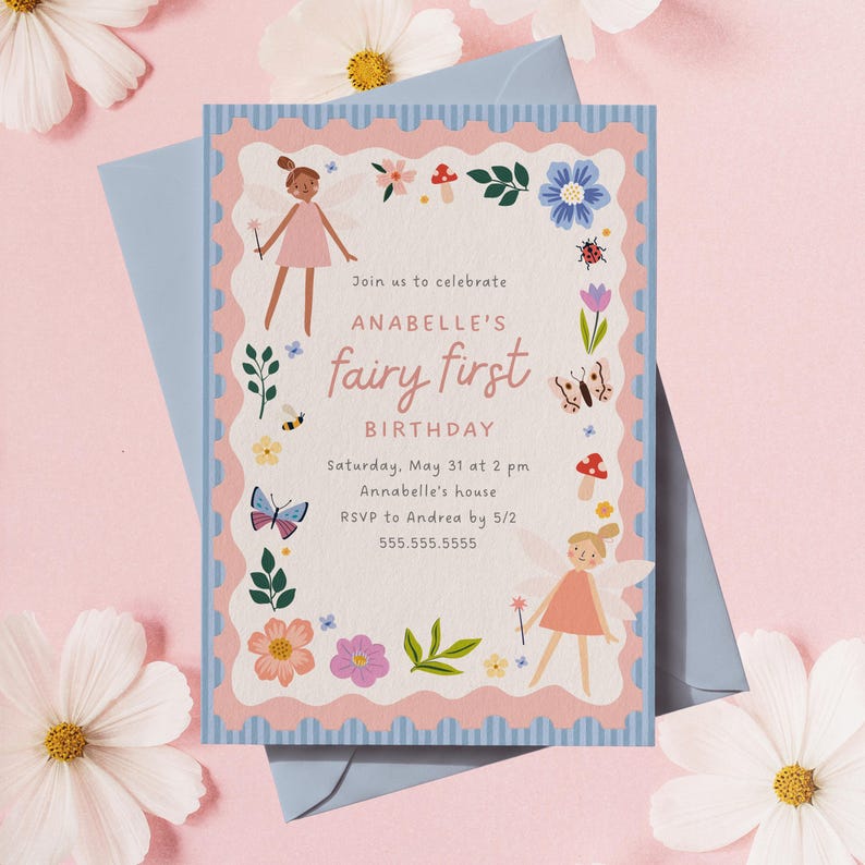 May include: A light blue envelope with a pink and blue invitation. The invitation reads "Join us to celebrate ANABELLE'S fairy first BIRTHDAY" with floral and fairy illustrations. The date and time are included. The invitation is surrounded by flowers.