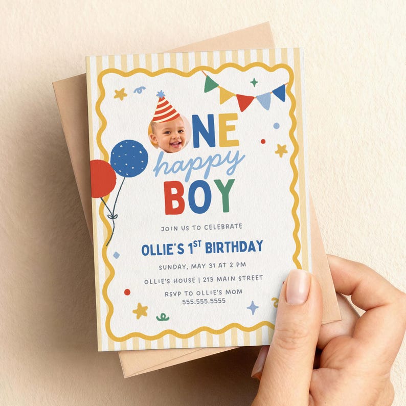 May include: A birthday invitation with the text "ONE happy BOY" and "Ollie's 1st Birthday." The invitation has a photo of a baby wearing a party hat, balloons, and colorful decorations. The invitation is held in a hand.