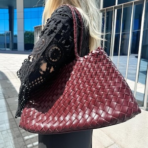 May include: A set of three ceramic mugs with a speckled, matte finish. The mugs are in shades of cream, light gray, and dark gray. Each mug has a simple, minimalist design and a rounded handle.