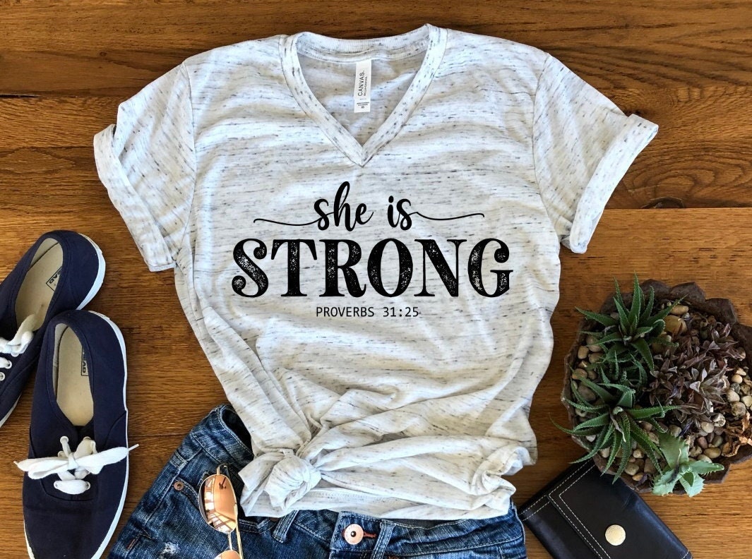 She Is Strong Proverbs 31 25, Motivational, Christian Tee, Inspirational Unisex V Neck Graphic Tee T-Shirt
