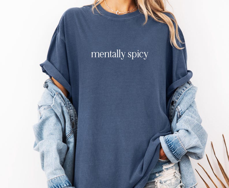 May include: An oversized navy blue t-shirt with the text "mentally spicy" printed in white on the front.