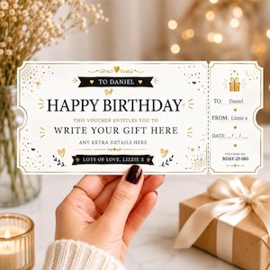 May include: A rectangular birthday gift voucher printed on white paper with gold and black accents. The text reads: TO DANIEL, HAPPY BIRTHDAY, THIS VOUCHER ENTITLES YOU TO WRITE YOUR GIFT HERE, ANY EXTRA DETAILS HERE, LOTS OF LOVE, LIZZIE X.