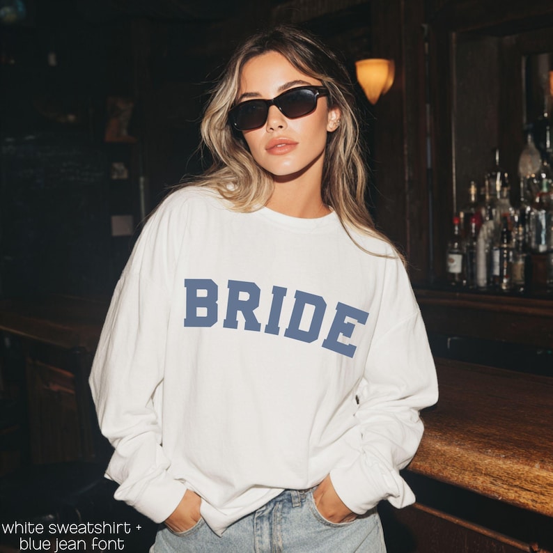 Bride Crewneck Bridal Sweatshirt Engaged gift for her custom mrs shirt announce engagement personalized wifey get married custom engaged shirt bride getting ready outfit future mrs engaged just engaged gift just married shirt bride hoodie mrs hoodie wifey sweatshirt bride mrs sweatshirt. bride clothes, wedding newly engaged gift. This is a custom bride crewneck bridal sweatshirt. It's a gildan 18000 crewneck sweatshirt.