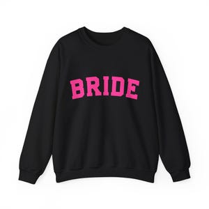 Bride Crewneck Bridal Sweatshirt Engaged gift for her custom mrs shirt announce engagement personalized wifey get married custom engaged shirt bride getting ready outfit future mrs engaged just engaged gift just married shirt bride hoodie mrs hoodie wifey sweatshirt bride mrs sweatshirt. bride clothes, wedding newly engaged gift. This is a custom bride crewneck bridal sweatshirt. It's a gildan 18000 crewneck sweatshirt.