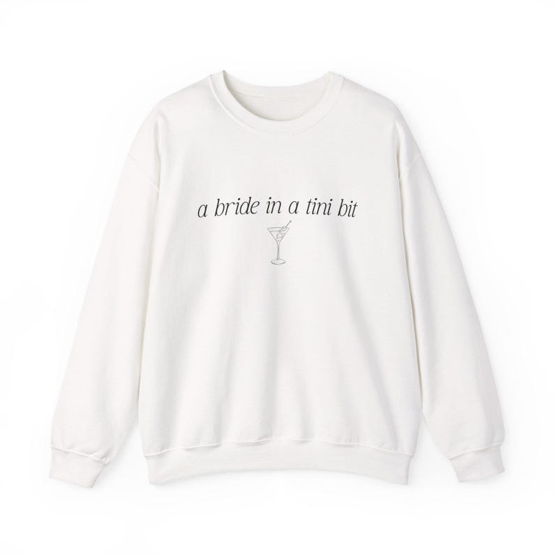 Bride in a Tini Bit Bride Shirt Tini Bit Engaged Bachelorette Party Custom Bachelorette Shirt for Bride to Be, Bride Sweatshirt Future Mrs Shirt, Mrs Personalized Bride Shirt | Bride Clothes Future Mrs Engaged Custom Mrs Shirt Custom Wife Shirt. Bridal Sweatshirt Bachelorette Shirts. Custom Bachelorette Shirt Bachelorette Party Shirts. Custom Bridesmaid Shirts This is a personalized getting ready outfit for wedding day. Perfect for a wedding newly engaged gift. It is a comfort colors 1717 shirt.