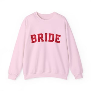 Bride Crewneck Bridal Sweatshirt Engaged gift for her custom mrs shirt announce engagement personalized wifey get married custom engaged shirt bride getting ready outfit future mrs engaged just engaged gift just married shirt bride hoodie mrs hoodie wifey sweatshirt bride mrs sweatshirt. bride clothes, wedding newly engaged gift. This is a custom bride crewneck bridal sweatshirt. It's a gildan 18000 crewneck sweatshirt.