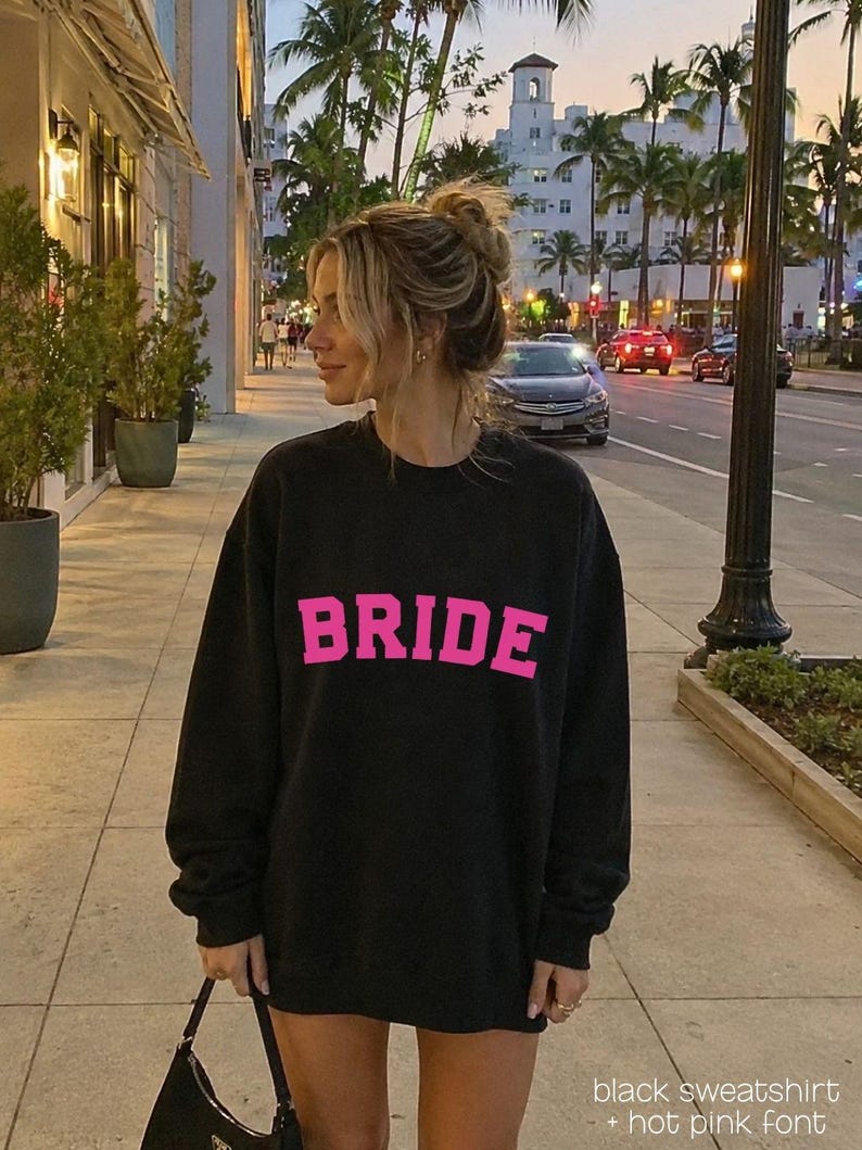 Bride Crewneck Bridal Sweatshirt Engaged gift for her custom mrs shirt announce engagement personalized wifey get married custom engaged shirt bride getting ready outfit future mrs engaged just engaged gift just married shirt bride hoodie mrs hoodie wifey sweatshirt bride mrs sweatshirt. bride clothes, wedding newly engaged gift. This is a custom bride crewneck bridal sweatshirt. It's a gildan 18000 crewneck sweatshirt.