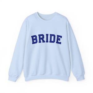 Bride Crewneck Bridal Sweatshirt Engaged gift for her custom mrs shirt announce engagement personalized wifey get married custom engaged shirt bride getting ready outfit future mrs engaged just engaged gift just married shirt bride hoodie mrs hoodie wifey sweatshirt bride mrs sweatshirt. bride clothes, wedding newly engaged gift. This is a custom bride crewneck bridal sweatshirt. It's a gildan 18000 crewneck sweatshirt.