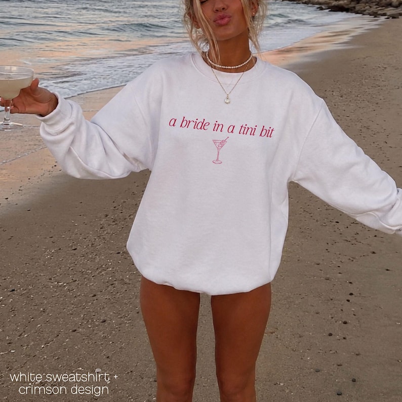 Bride in a Tini Bit Bride Shirt Tini Bit Engaged Bachelorette Party Custom Bachelorette Shirt for Bride to Be, Bride Sweatshirt Future Mrs Shirt, Mrs Personalized Bride Shirt | Bride Clothes Future Mrs Engaged Custom Mrs Shirt Custom Wife Shirt. Bridal Sweatshirt Bachelorette Shirts. Custom Bachelorette Shirt Bachelorette Party Shirts. Custom Bridesmaid Shirts This is a personalized getting ready outfit for wedding day. Perfect for a wedding newly engaged gift. It is a comfort colors 1717 shirt.
