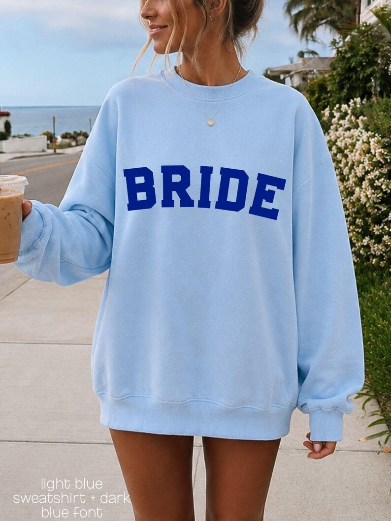 Bride Crewneck Bridal Sweatshirt Engaged gift for her custom mrs shirt announce engagement personalized wifey get married custom engaged shirt bride getting ready outfit future mrs engaged just engaged gift just married shirt bride hoodie mrs hoodie wifey sweatshirt bride mrs sweatshirt. bride clothes, wedding newly engaged gift. This is a custom bride crewneck bridal sweatshirt. It's a gildan 18000 crewneck sweatshirt.