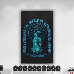 May include: Black wall tapestry with a teal illustration of a muscular figure holding a hammer above a globe. Text in teal reads "Man conquers the world by conquering himself" and "Zeno of Citium."