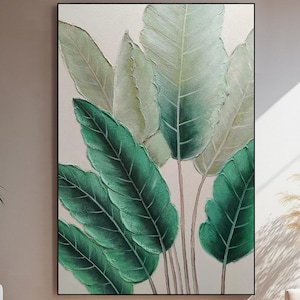 Arte mural de hojas tropicales grandes sobre lienzo, pintura al óleo botánica verde pintada a mano con acabado texturizado para una decoración de habitación moderna inspirada en la naturaleza.