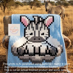 May include: A light blue knitted blanket featuring a zebra design with pink ears, black and white stripes, and gray accents. The blanket is draped over a chair. A real zebra stands in the background. The text on the blanket says "The Snuggle Spot".
