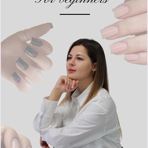 May include: An image promoting Russian manicure techniques, featuring a woman in a white shirt. The text reads "RUSSIAN MANICURE For beginners". The image shows examples of manicured nails in grey and nude shades.