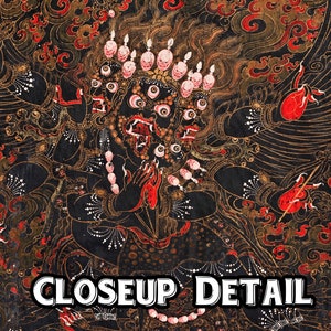 May include: A detailed painting of a multi-headed deity with a fierce expression. The deity has multiple eyes, a large mouth with fangs, and is adorned with intricate patterns and jewelry. The painting is done in a traditional style with vibrant colors, including red, gold, and black.