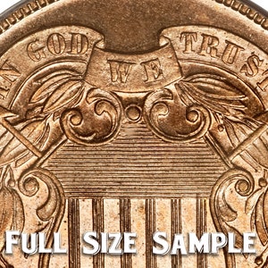 May include: Close-up of a gold-colored coin with the inscription "IN GOD WE TRUST" on the top half of the coin. The bottom half of the coin features a shield with vertical stripes and a design of two eagles with wings spread.
