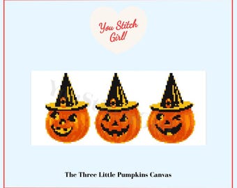 May include: A pixel art design featuring three orange pumpkins wearing black and yellow witch hats. Each pumpkin has a unique carved face expression. Above the pumpkins is a heart shape with the text You Stitch Girl! and below is the text The Three Little Pumpkins Canvas.