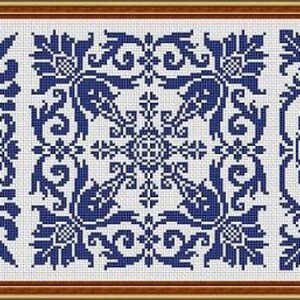 May include: A framed cross-stitch sampler featuring three square panels with intricate blue and white floral and geometric patterns. The design includes scrolling vines, stylized flowers, and symmetrical arrangements. The number "1" is in the lower right corner.
