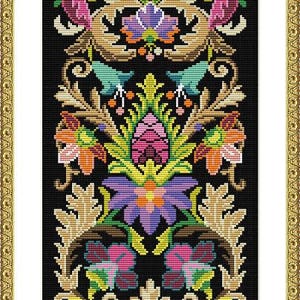 May include: A framed cross-stitch floral design on a black background. The design features symmetrical arrangements of flowers in pink, purple, and teal, with gold-coloured leaf accents. The frame is gold.