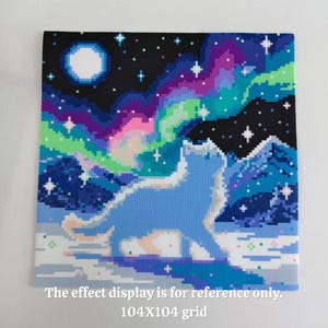 May include: A square pixel art design featuring a light blue cat silhouette standing in a snowy landscape under a vibrant aurora borealis with a full moon and stars. The text reads: The effect display is for reference only. 104X104 grid.