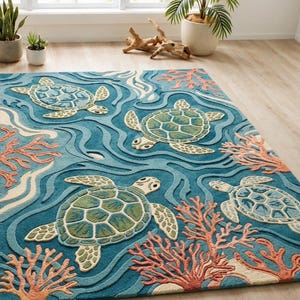 May include: A rectangular area rug with a sea turtle design. The rug features four sea turtles in shades of green and cream, swimming in a blue ocean with coral accents. The rug is made of a soft, plush material.